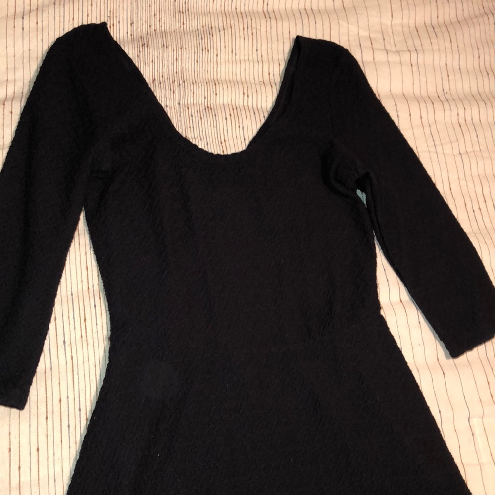 Black dress with open back with bow.